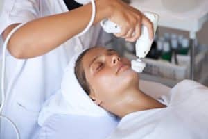 Woman getting facial treatment