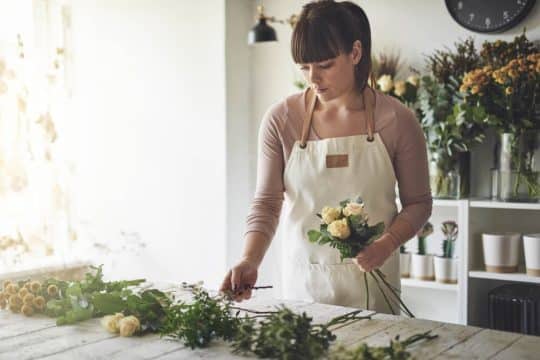 Woman arranging flowers