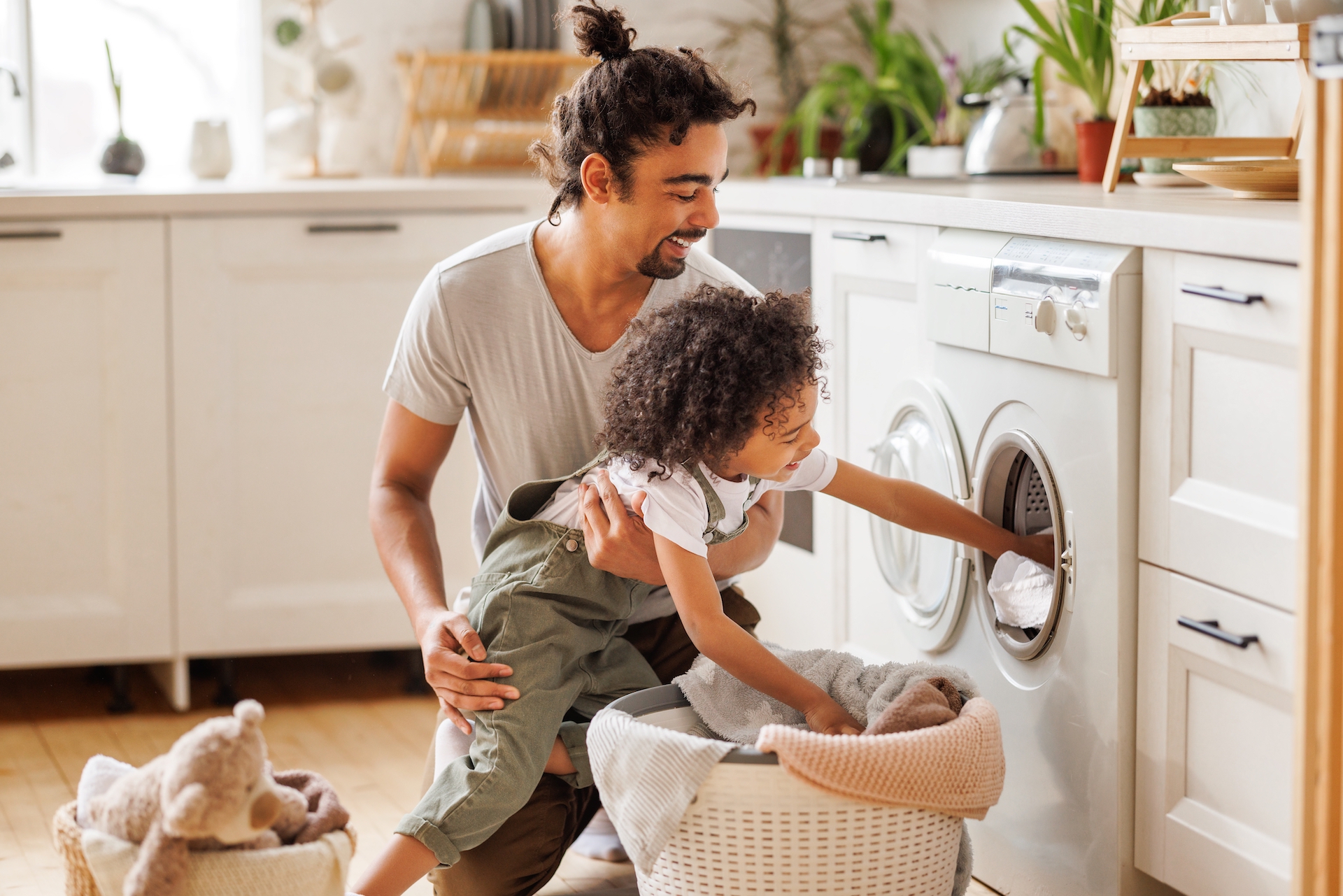 Man and son doing laundry