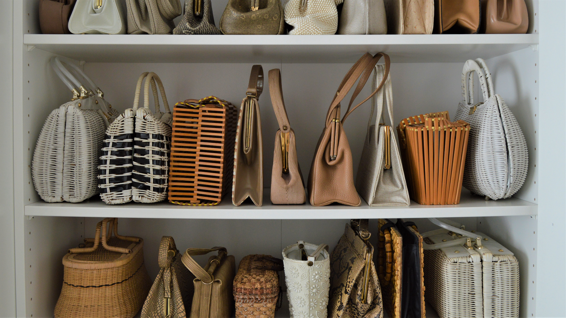Close up of organized purses in a closet