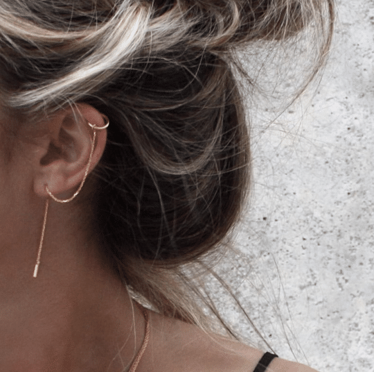 Gold cuff with chain earring