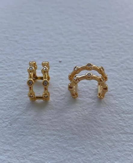 Studded gold ear cuff with diamonds